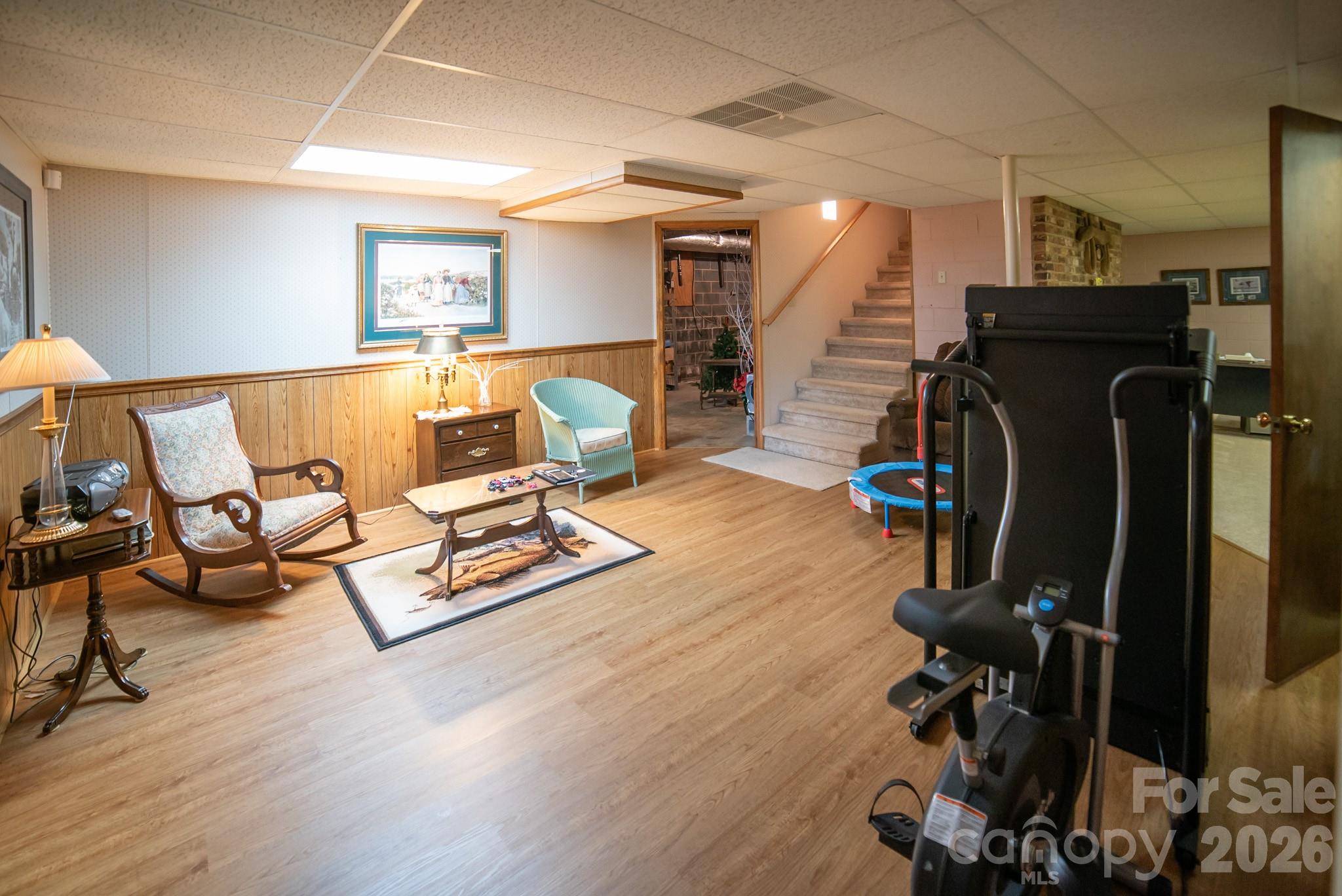 1368 Cajah Mountain Road Hudson, NC 28638 - Photo 21 of 36 a living room with furniture and a wooden floor