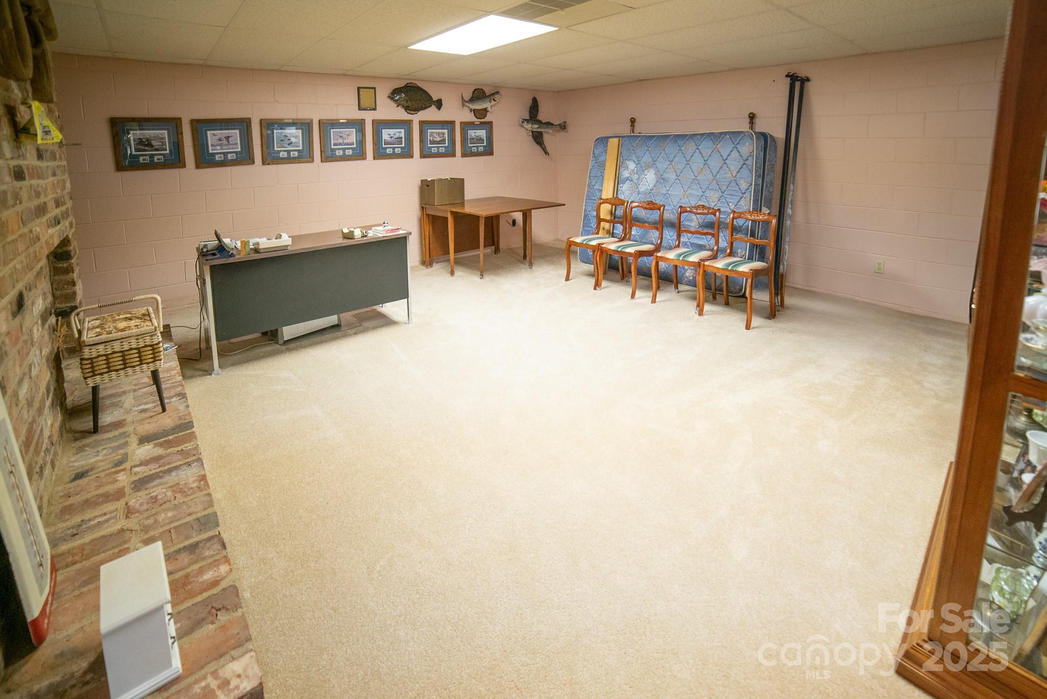 1368 Cajah Mountain Road Hudson, NC 28638 - Photo 22 of 36 a living room with furniture and a wooden floor