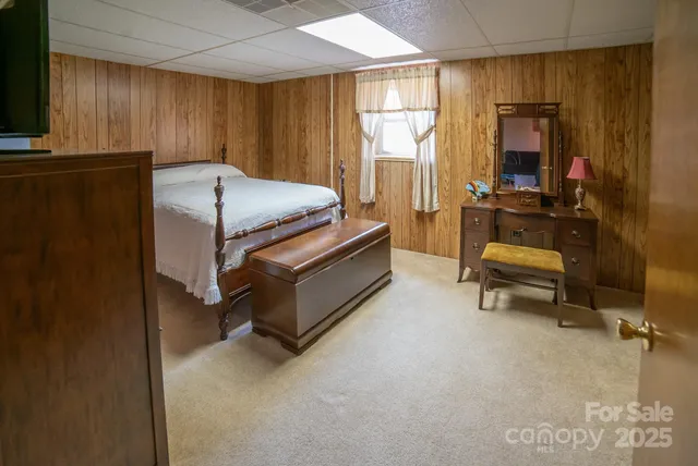 a bedroom with furniture and a window
