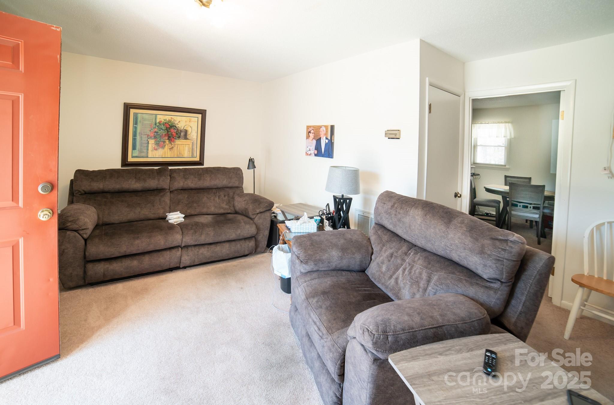 1368 Cajah Mountain Road Hudson, NC 28638 - Photo 28 of 36 a living room with furniture and a couch