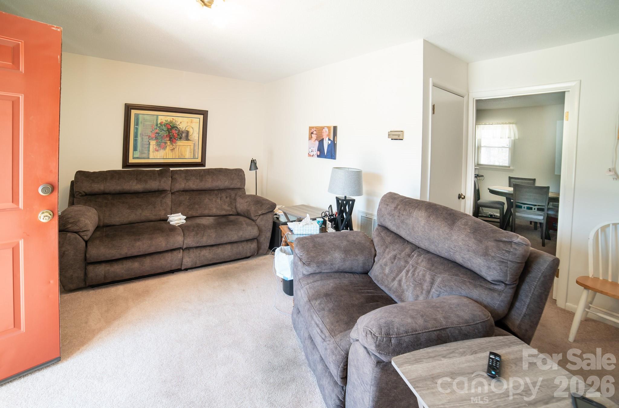 1368 Cajah Mountain Road Hudson, NC 28638 - Photo 28 of 36 a living room with furniture and a couch
