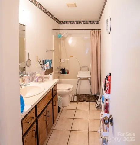 a bathroom with a sink mirror vanity and toilet