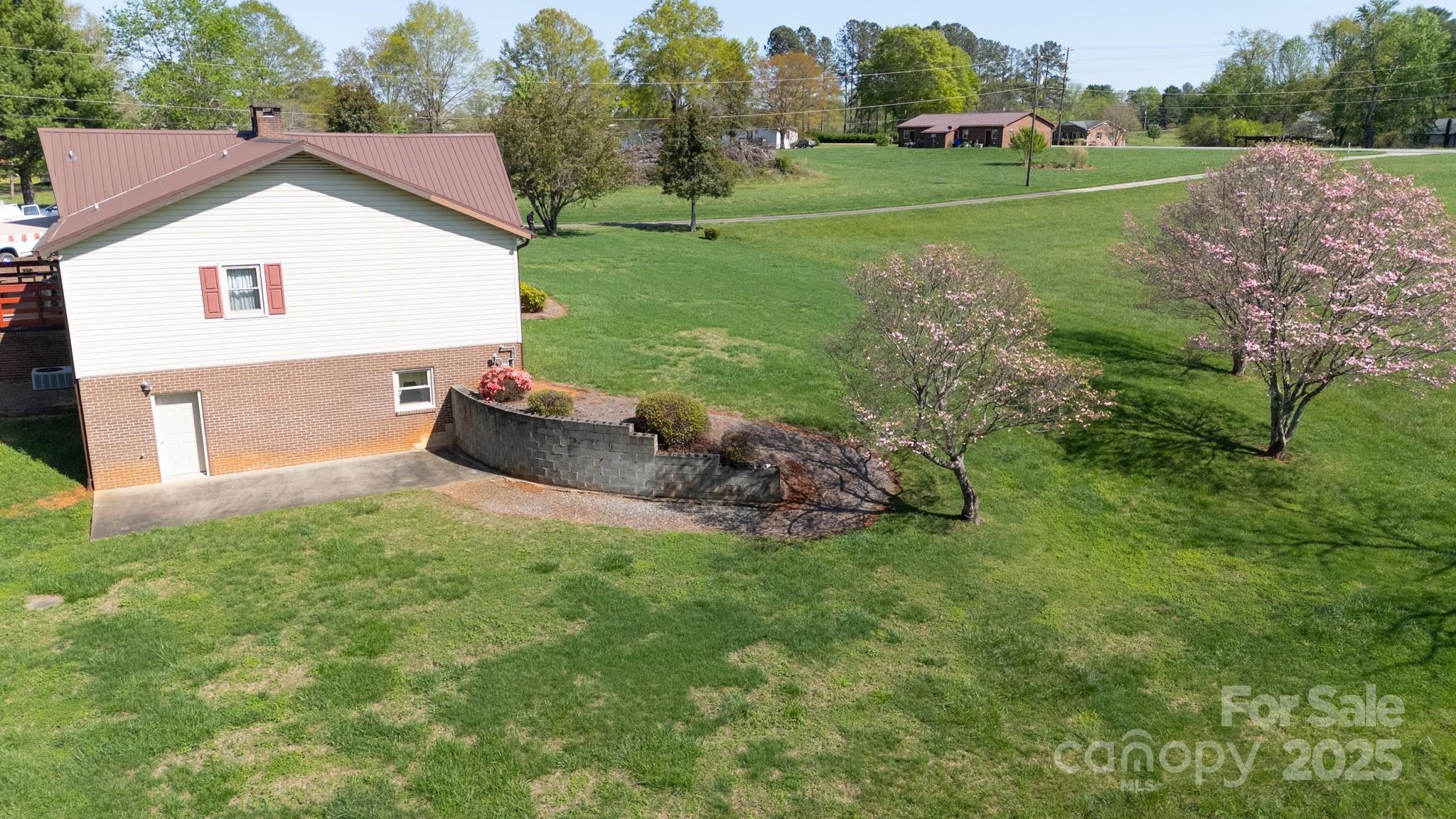 1368 Cajah Mountain Road Hudson, NC 28638 - Photo 32 of 36 a front view of a house with garden