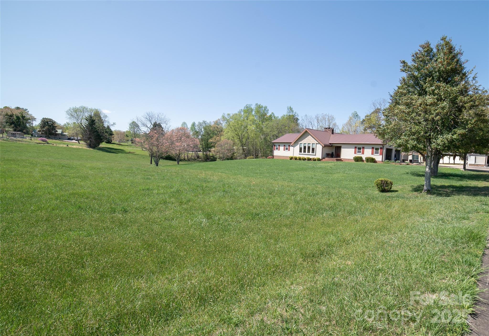1368 Cajah Mountain Road Hudson, NC 28638 - Photo 7 of 36 a big yard with lots of green space and plants