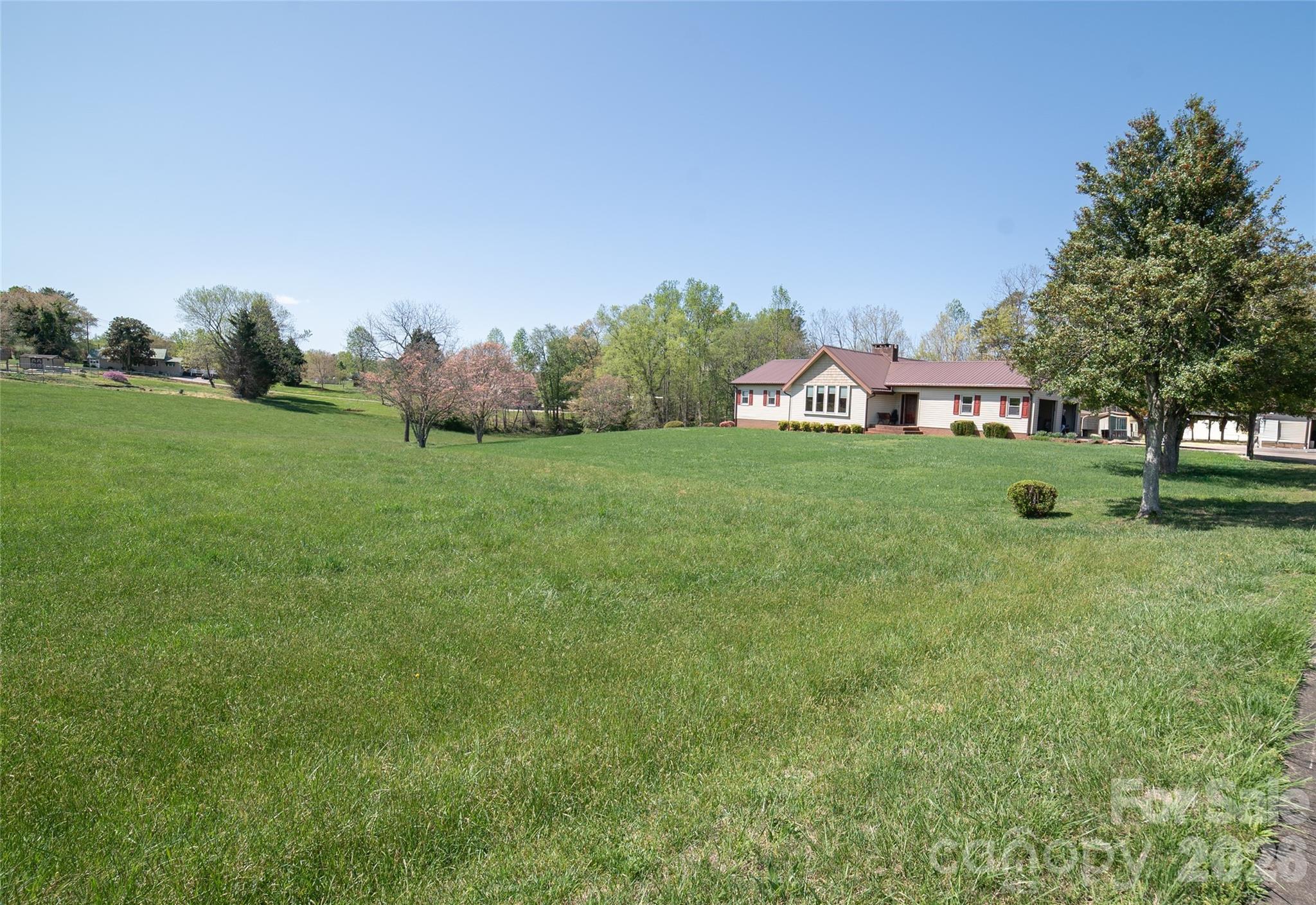 1368 Cajah Mountain Road Hudson, NC 28638 - Photo 7 of 36 a big yard with lots of green space and plants