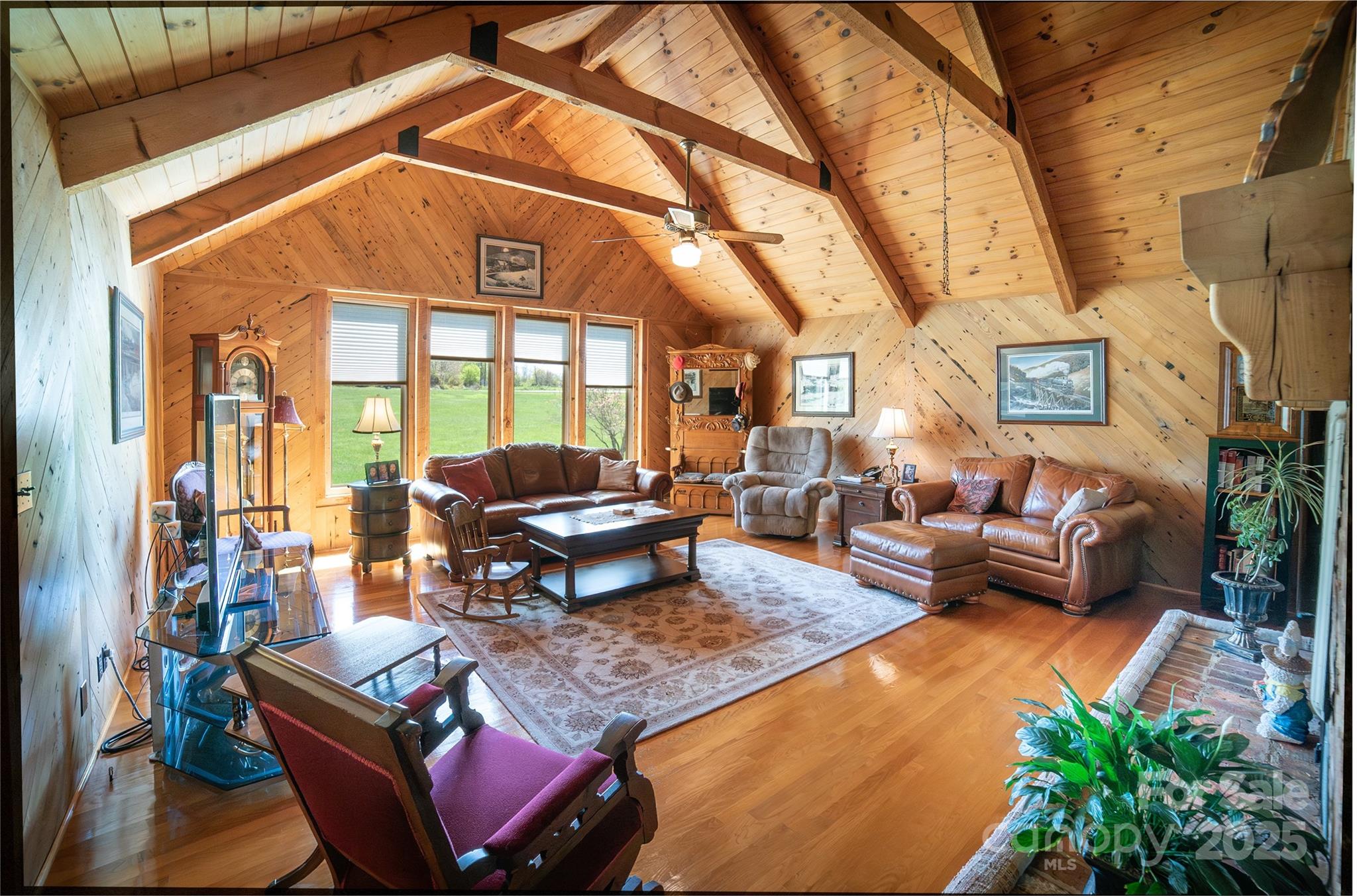 1368 Cajah Mountain Road Hudson, NC 28638 - Photo 9 of 36 a outdoor living space with furniture and a fireplace