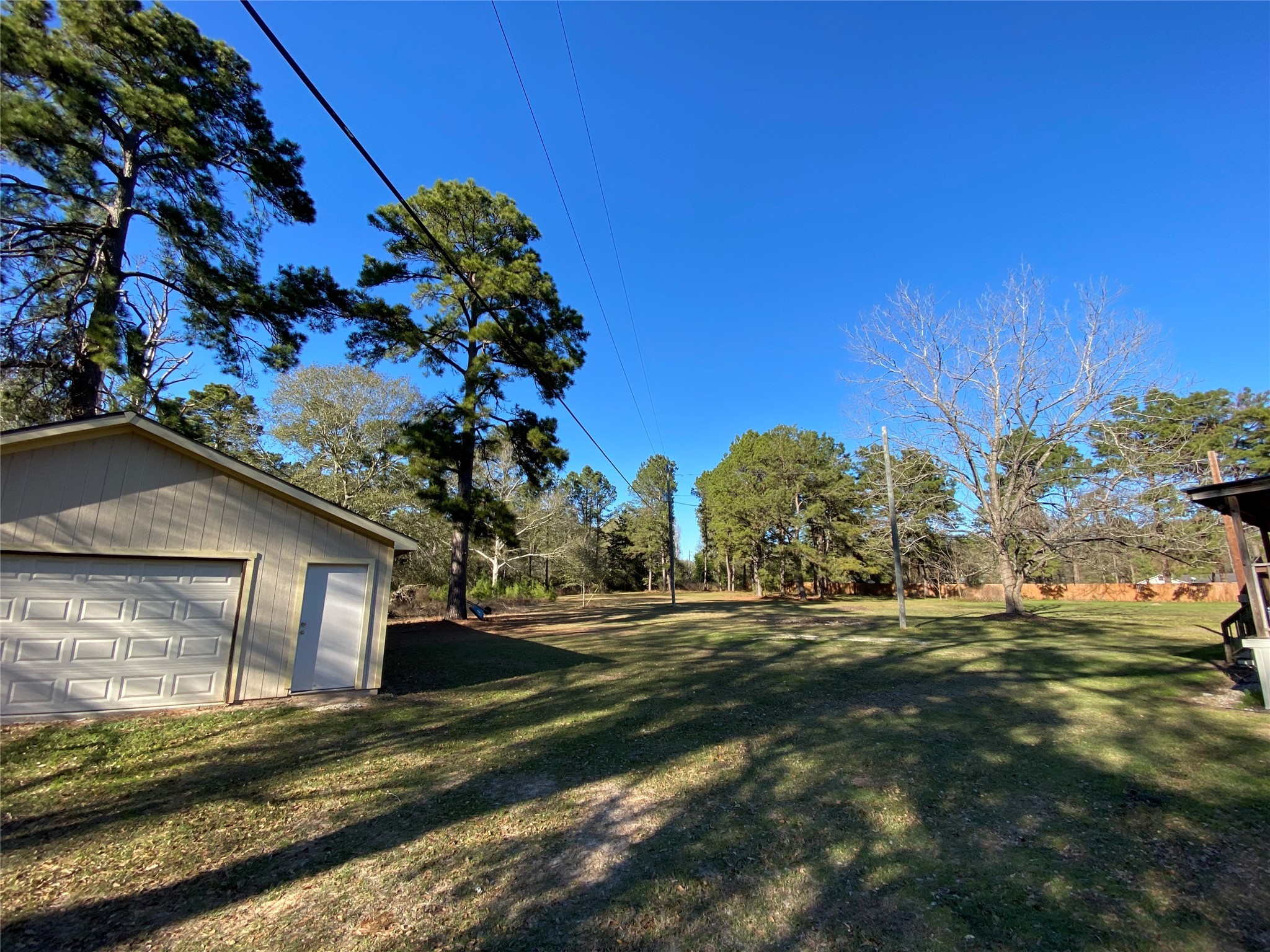 2581 Mann Road Conroe, TX 77303 - Photo 16 of 34 a front view of a house with a yard