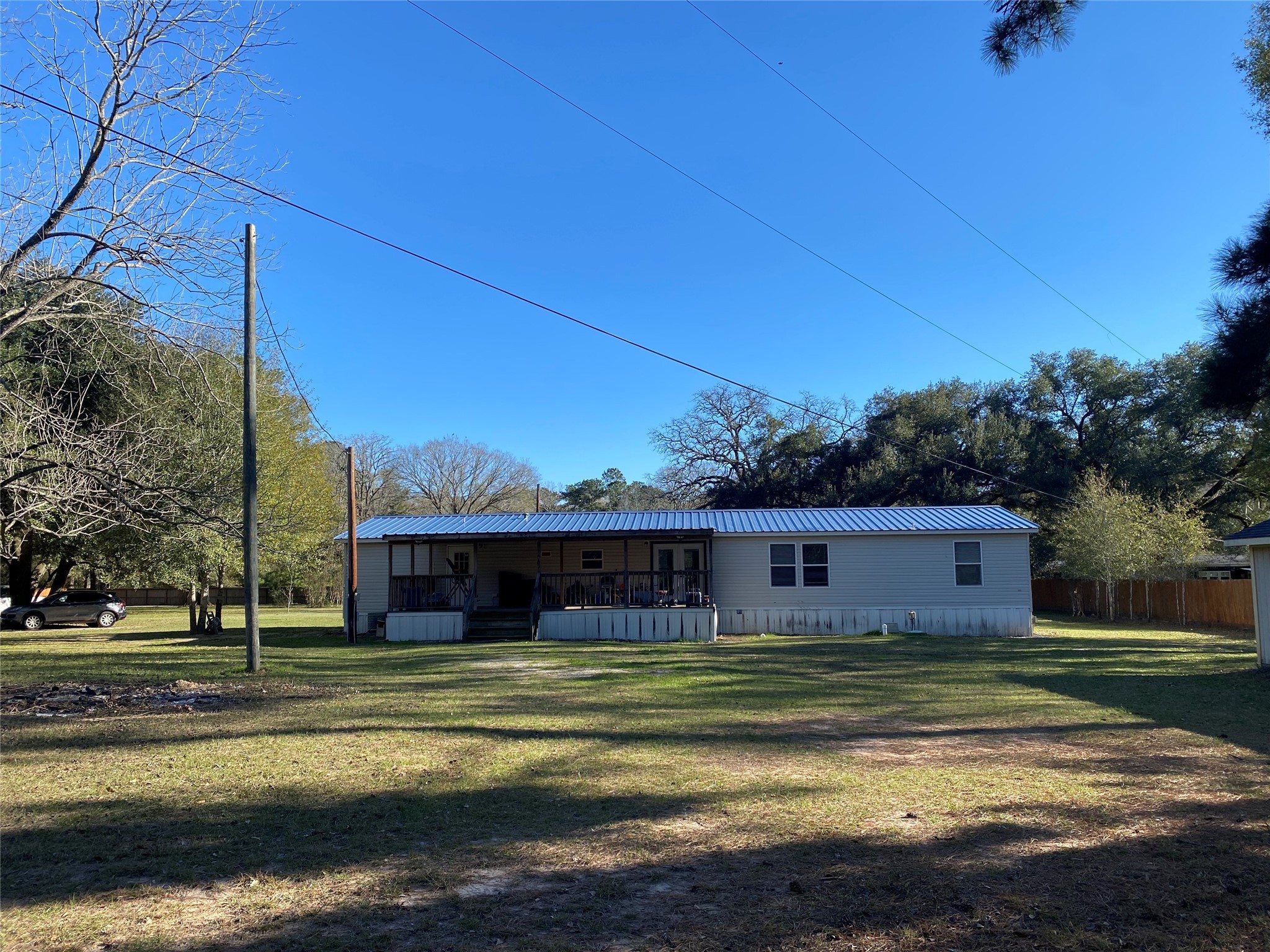 2581 Mann Road Conroe, TX 77303 - Photo 20 of 34 a view of a house with a big yard