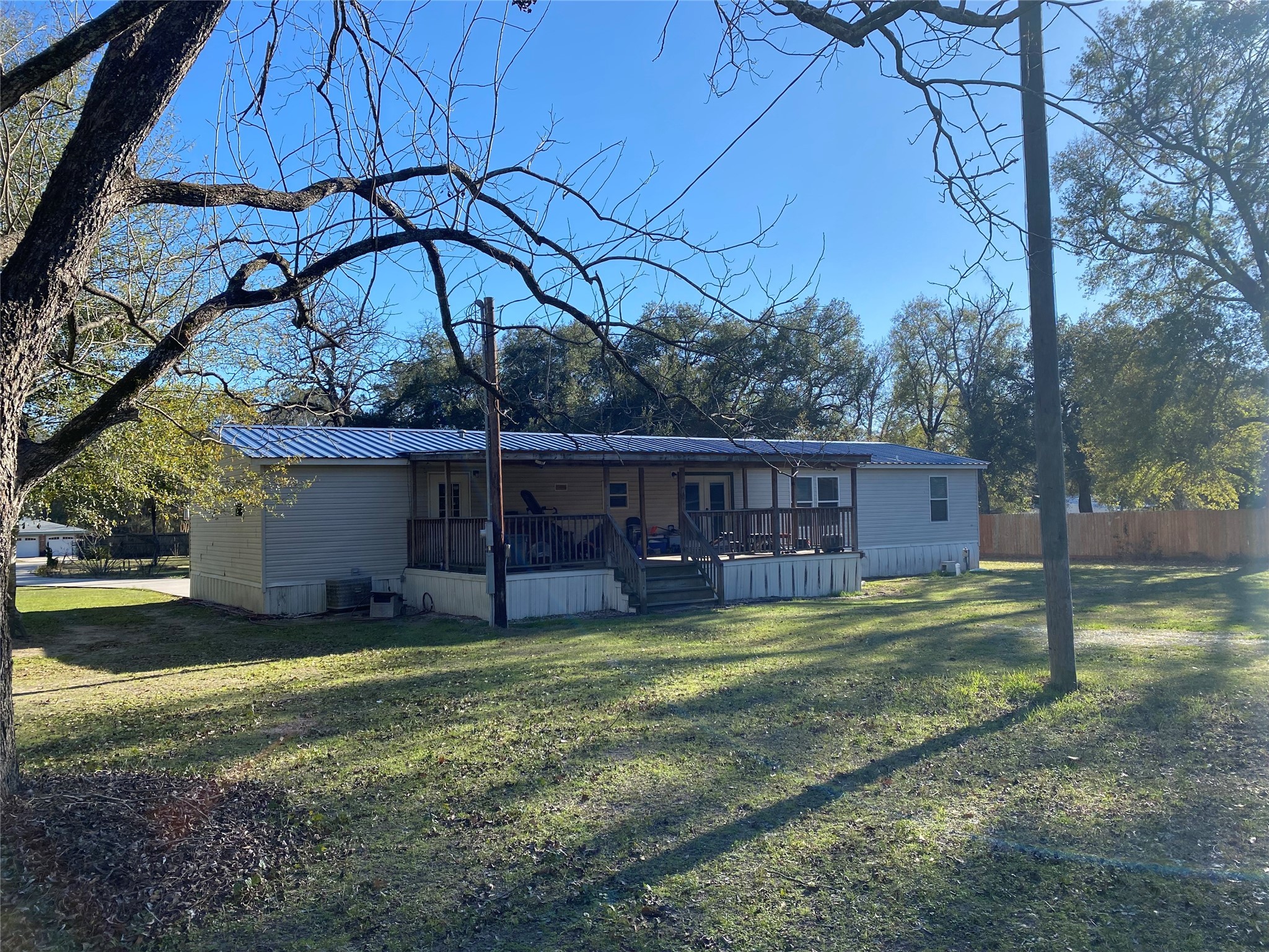 2581 Mann Road Conroe, TX 77303 - Photo 21 of 34 a view of a house with backyard and sitting area
