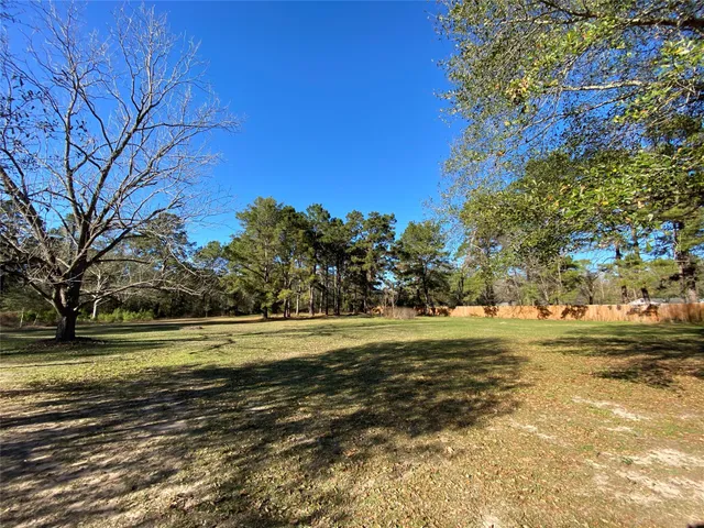a view of a patio with wooden floor