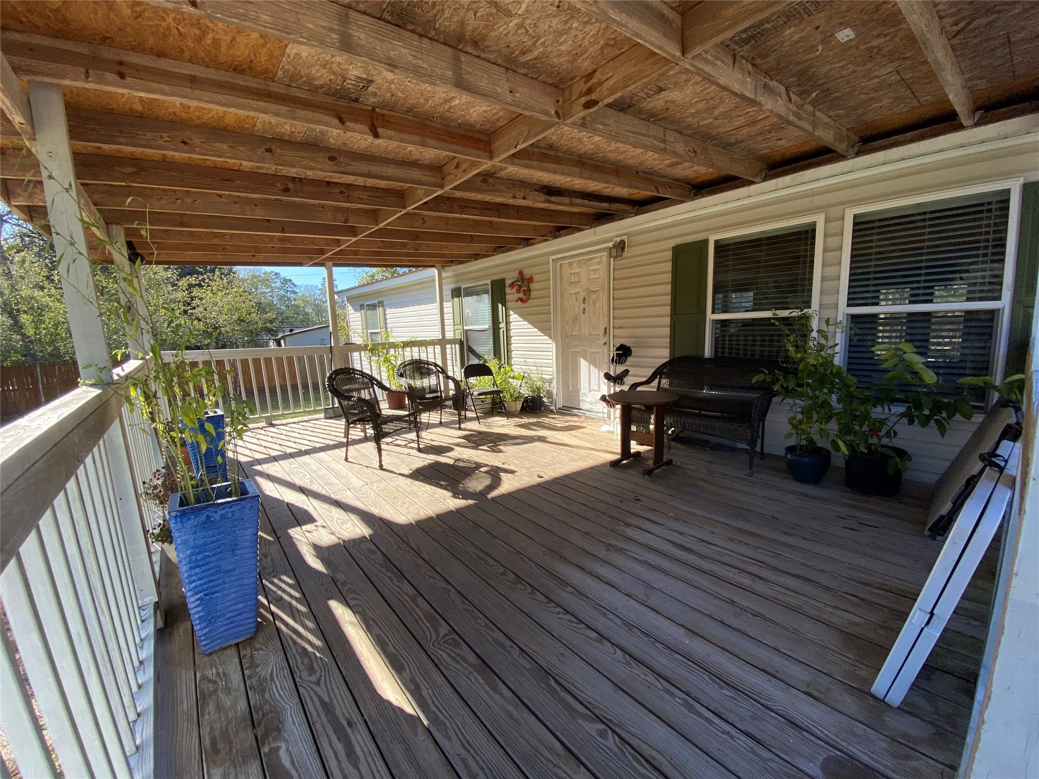 2581 Mann Road Conroe, TX 77303 - Photo 24 of 34 a view of a patio with wooden floor