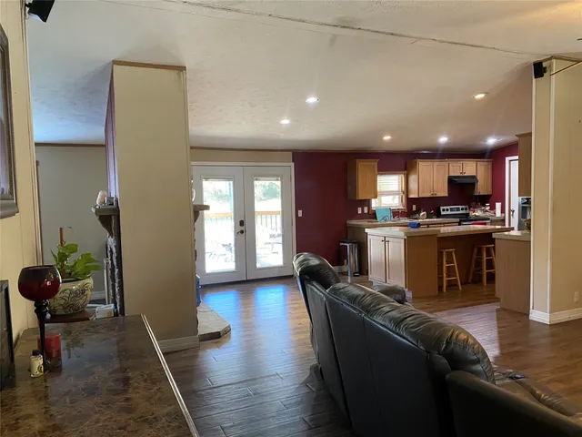 a kitchen with refrigerator and cabinets