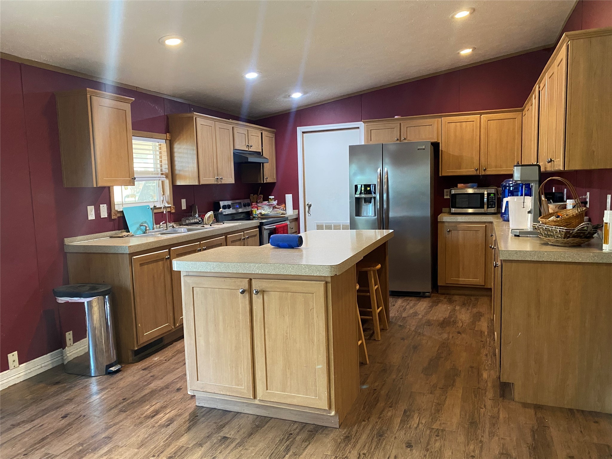 2581 Mann Road Conroe, TX 77303 - Photo 27 of 34 a kitchen with refrigerator and cabinets