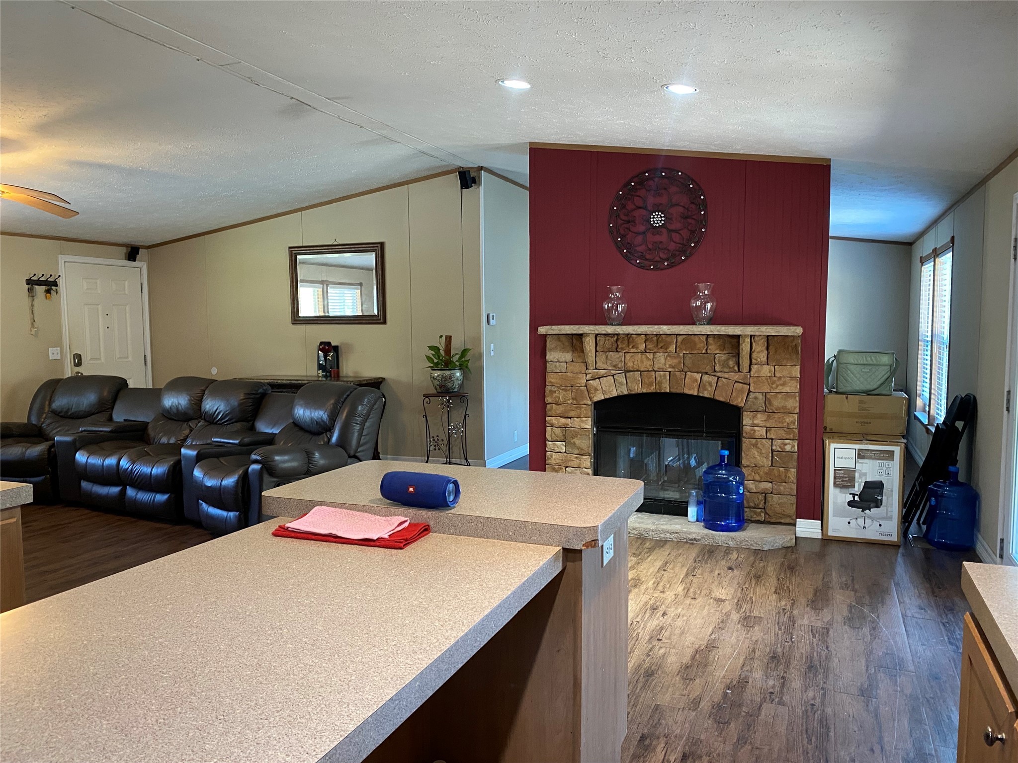 2581 Mann Road Conroe, TX 77303 - Photo 28 of 34 a living room with furniture a fireplace and wooden floor