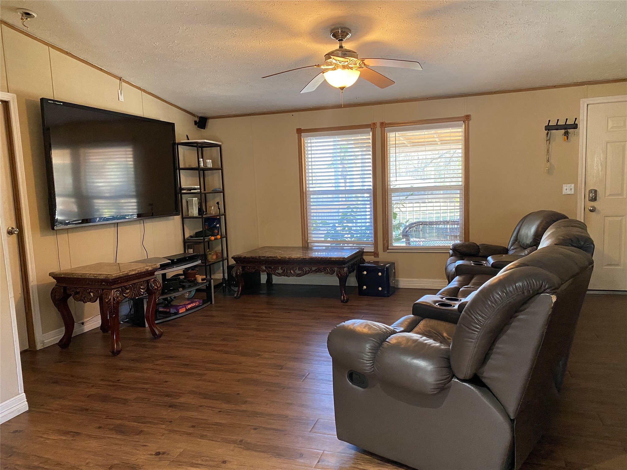 2581 Mann Road Conroe, TX 77303 - Photo 29 of 34 a living room with furniture and a flat screen tv