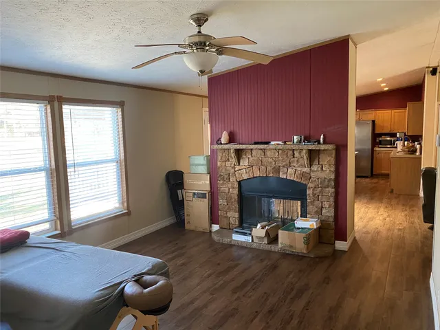a bedroom with furniture and wooden floor