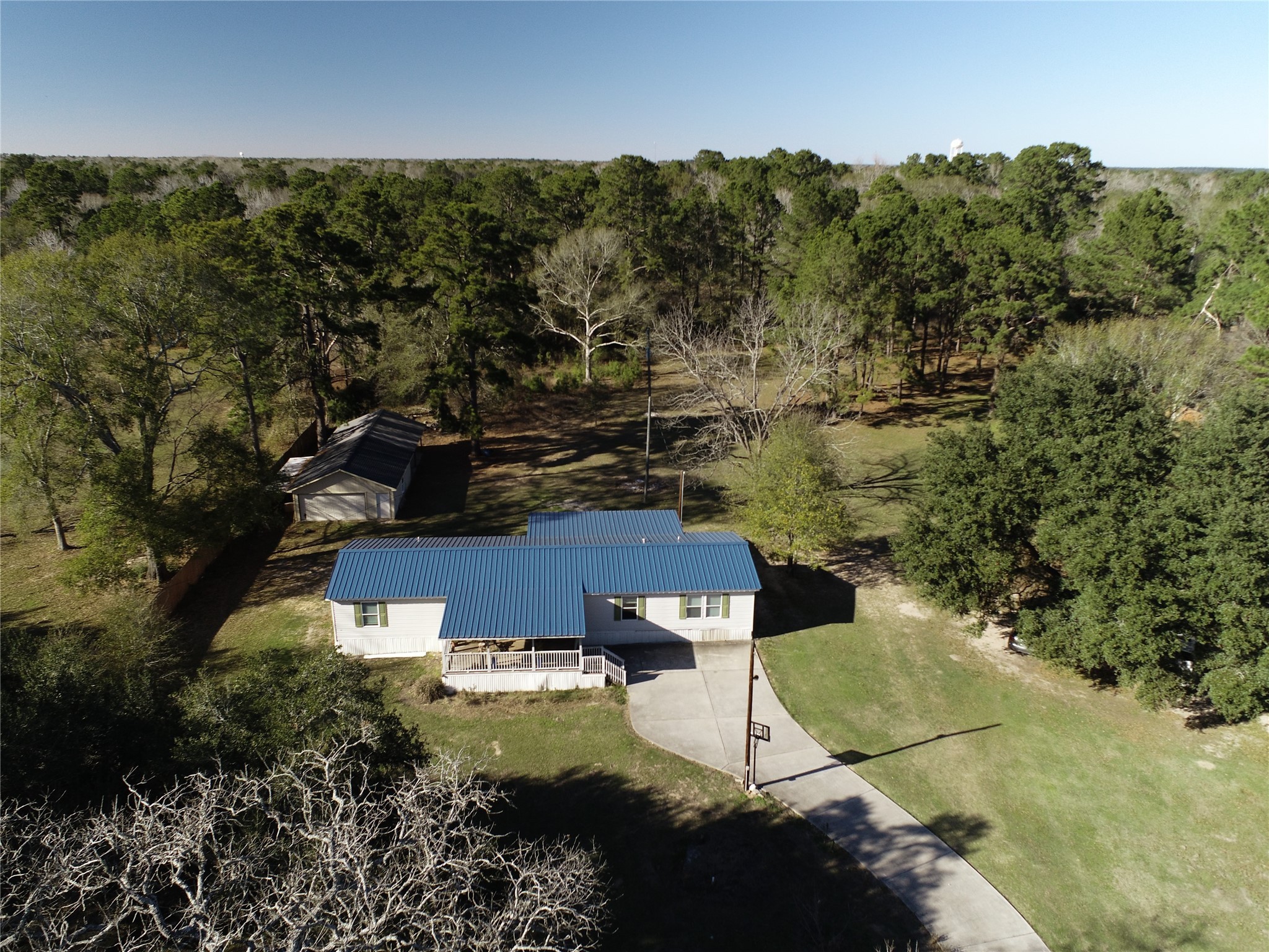 2581 Mann Road Conroe, TX 77303 - Photo 7 of 34 an aerial view of a house with a yard