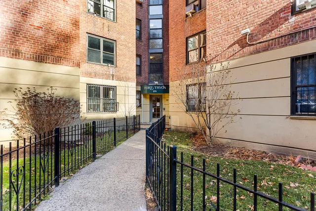 a view of parking space with city view