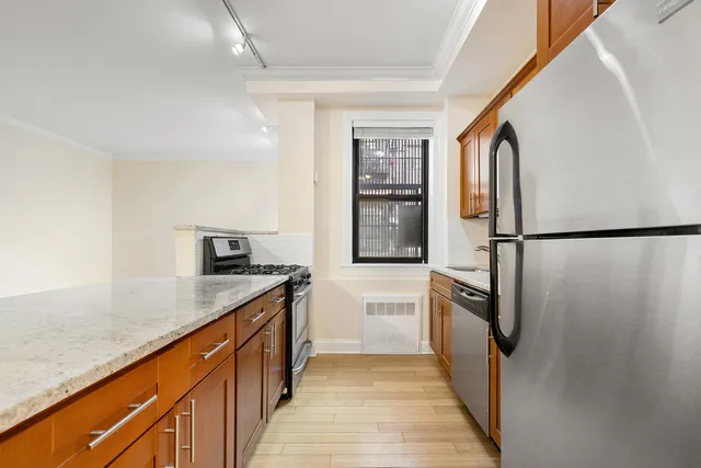 a view of a kitchen with a sink and dishwasher