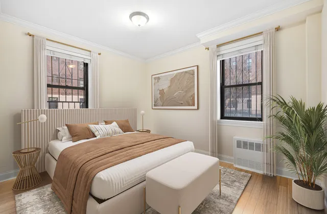 a kitchen with stainless steel appliances granite countertop a refrigerator a stove and a sink with wooden floor