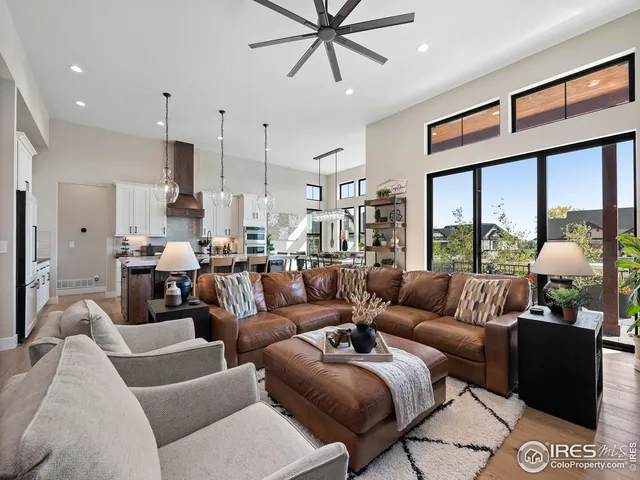 a kitchen with granite countertop a stove and a white cabinets