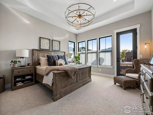 a en suite bathroom with a granite countertop sink a mirror and shower
