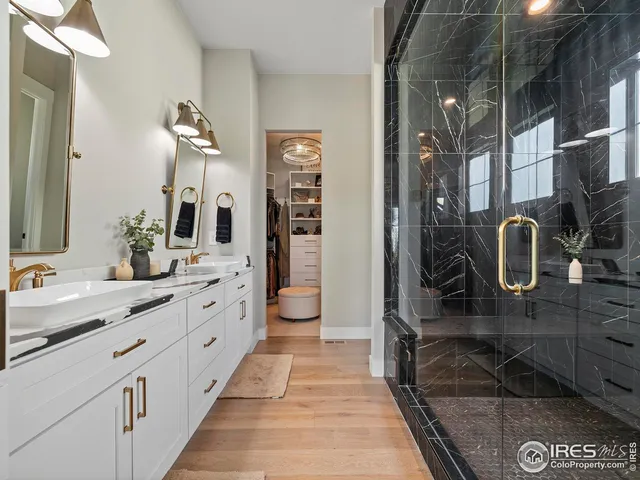 a bathroom with a double vanity sink and a mirror
