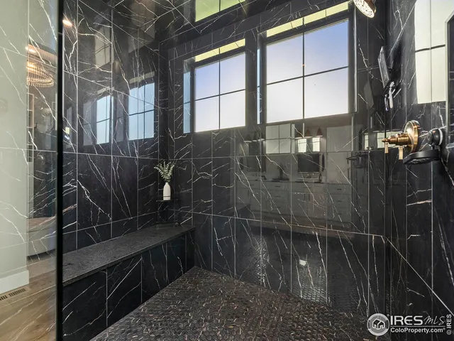 a living room with furniture chandelier and a dining table