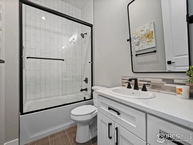 a large kitchen with kitchen island a sink a stove and a refrigerator