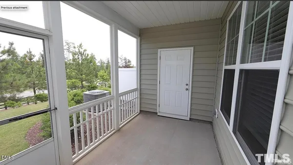 a view of a glass door and the balcony