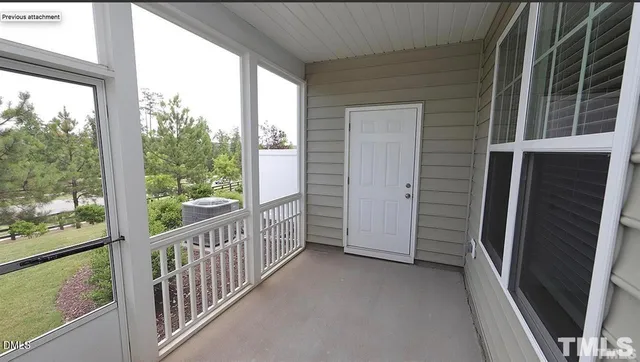 a view of a glass door and the balcony