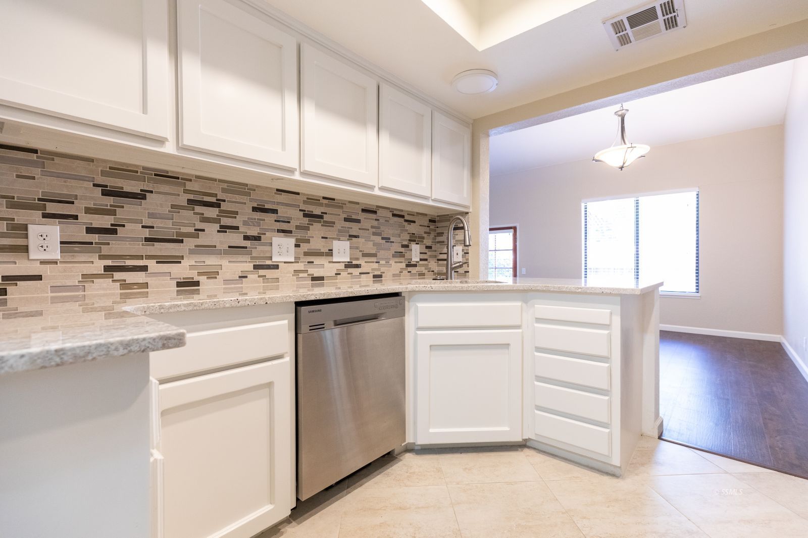 418 Tepatitlan Court Ridgecrest, CA 93555 - Photo 13 of 40 a kitchen with granite countertop white cabinets and white appliances
