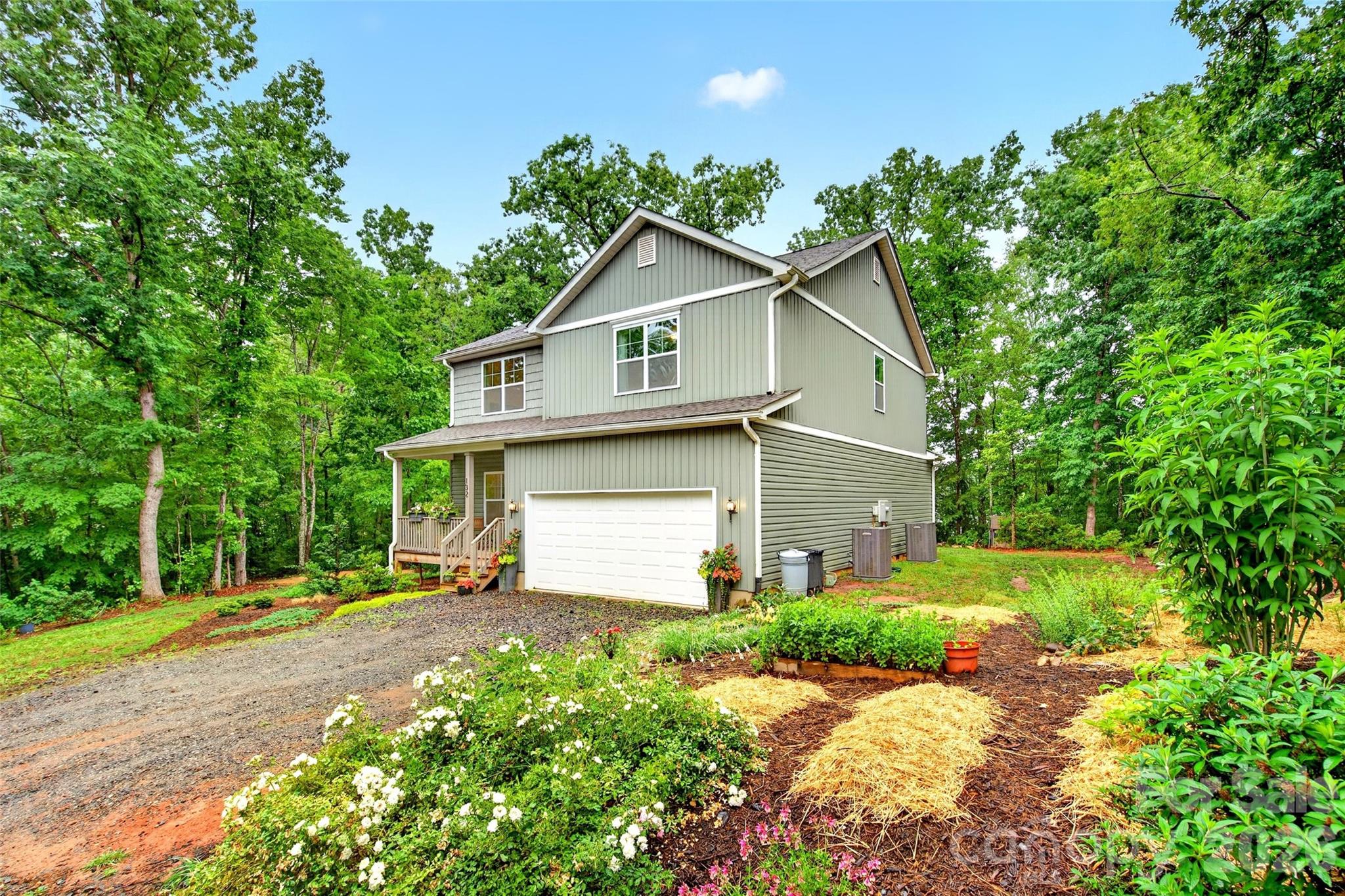 132 Maple Ridge Drive Old Fort, NC 28762 - Photo 2 of 40 a front view of a house with a yard and trees