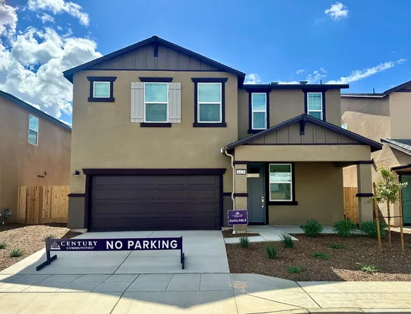 a front view of a house with garage