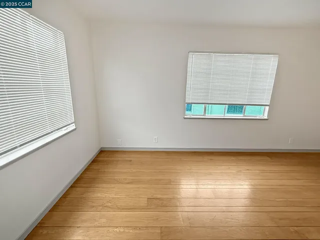 a view of room with wooden floor