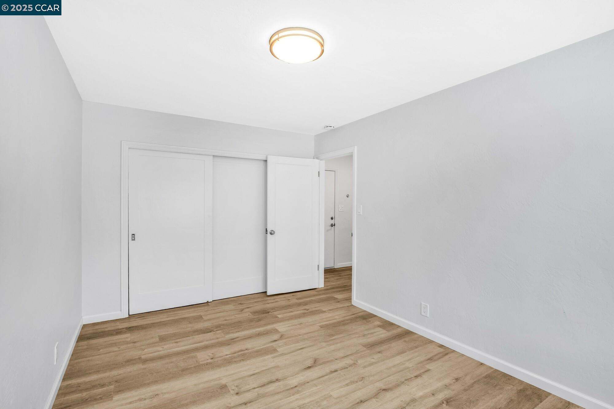 1919 Curtis Street Berkeley, CA 94702 - Photo 22 of 54 a view of room with wooden floor