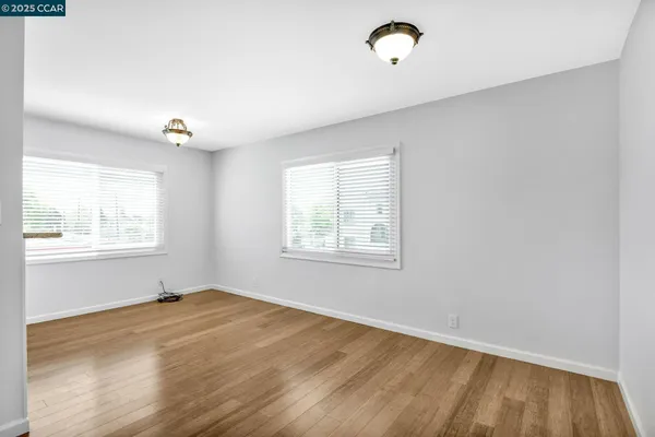 a view of a kitchen with wooden floor