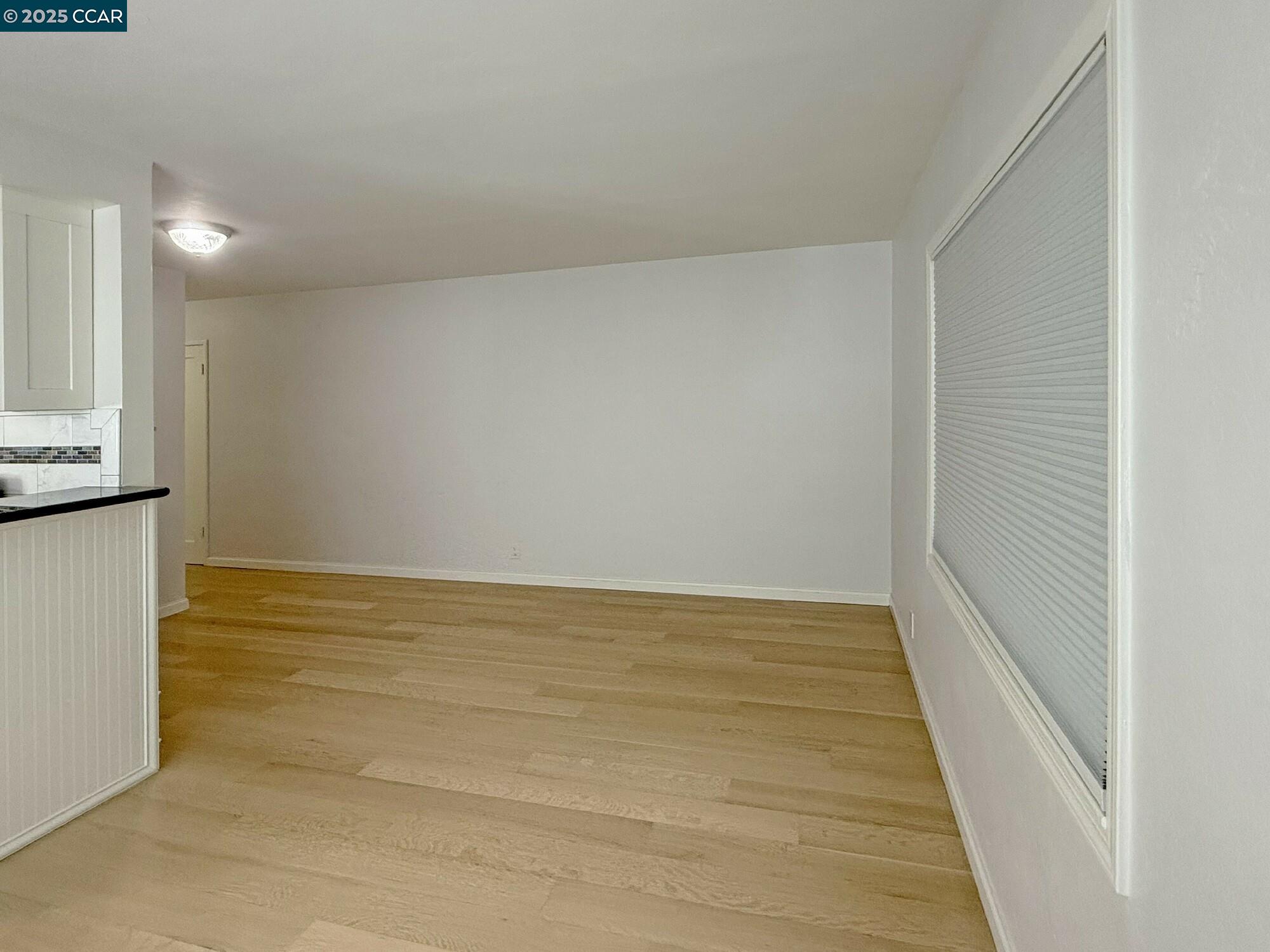 1919 Curtis Street Berkeley, CA 94702 - Photo 39 of 54 a view of room and wooden floor