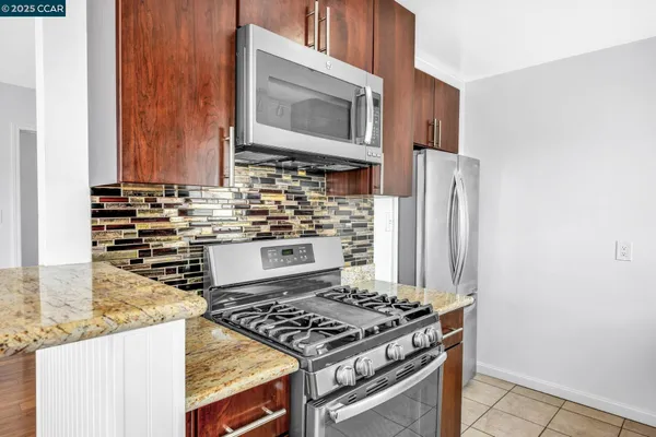 a kitchen with a sink and a wooden cabinets