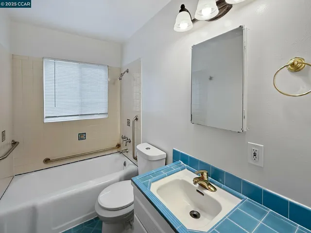 a view of washer and dryer with wooden floor