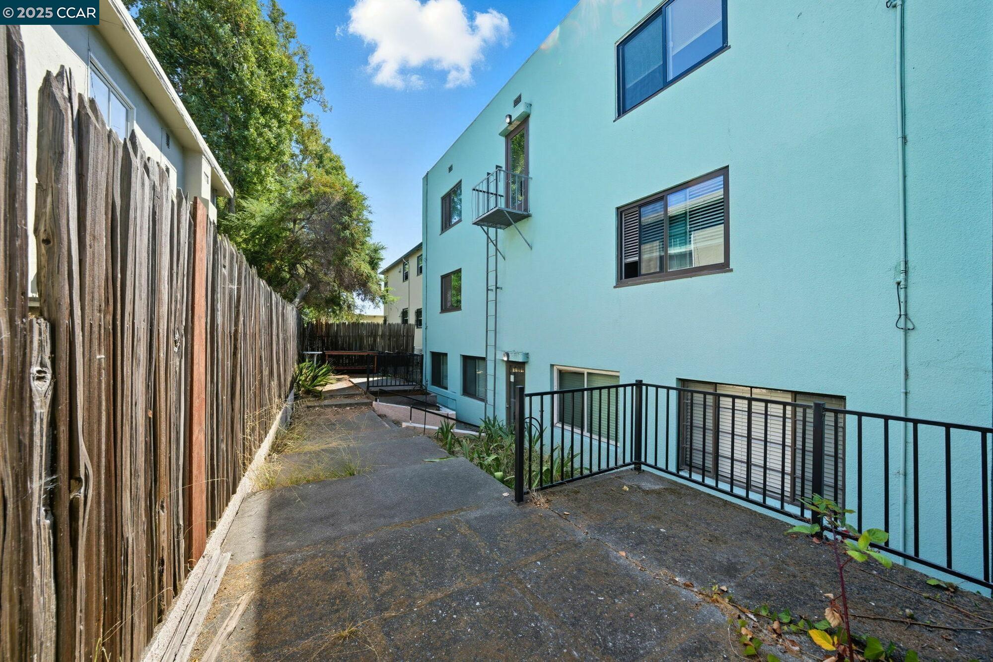 1919 Curtis Street Berkeley, CA 94702 - Photo 5 of 54 a view of a porch with wooden floor and fence