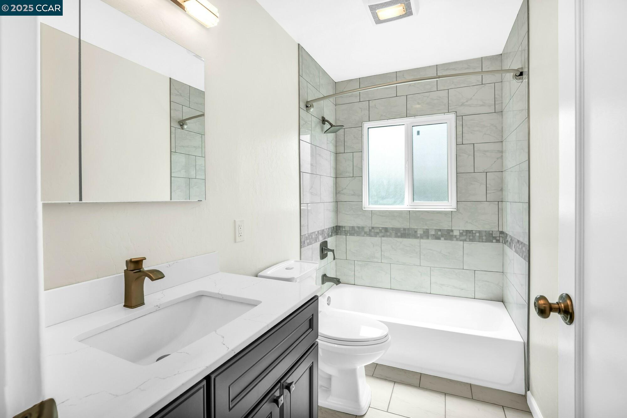 1919 Curtis Street Berkeley, CA 94702 - Photo 52 of 54 a bathroom with a sink a toilet and shower