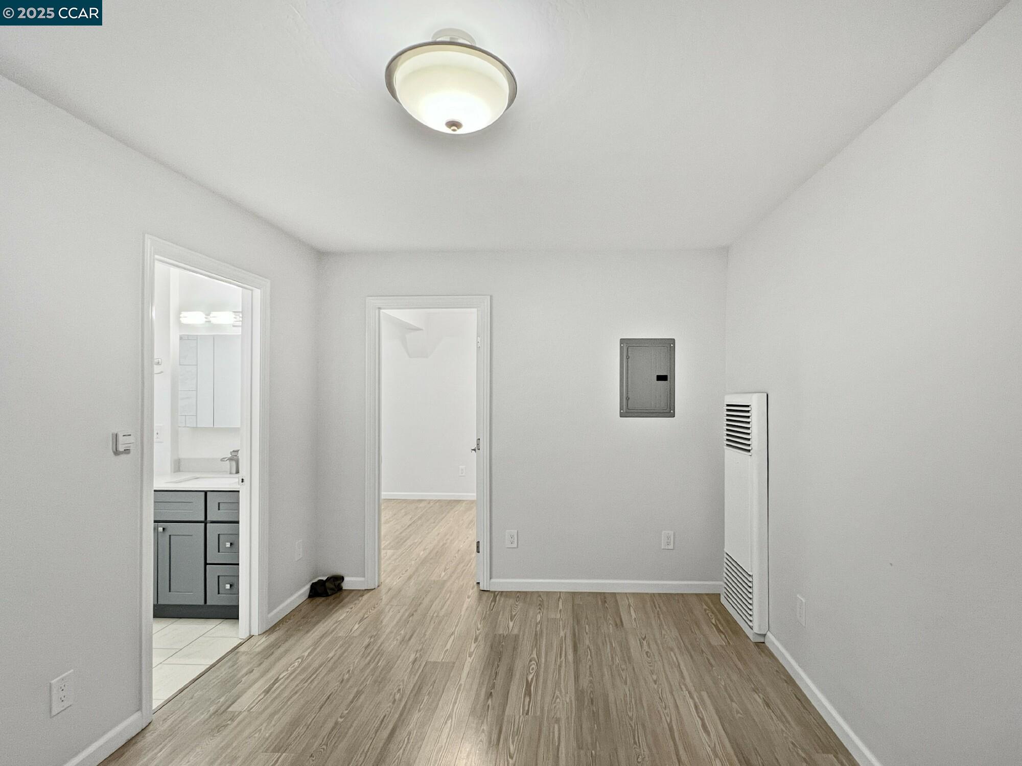 1919 Curtis Street Berkeley, CA 94702 - Photo 8 of 54 a view of a room with wooden floor