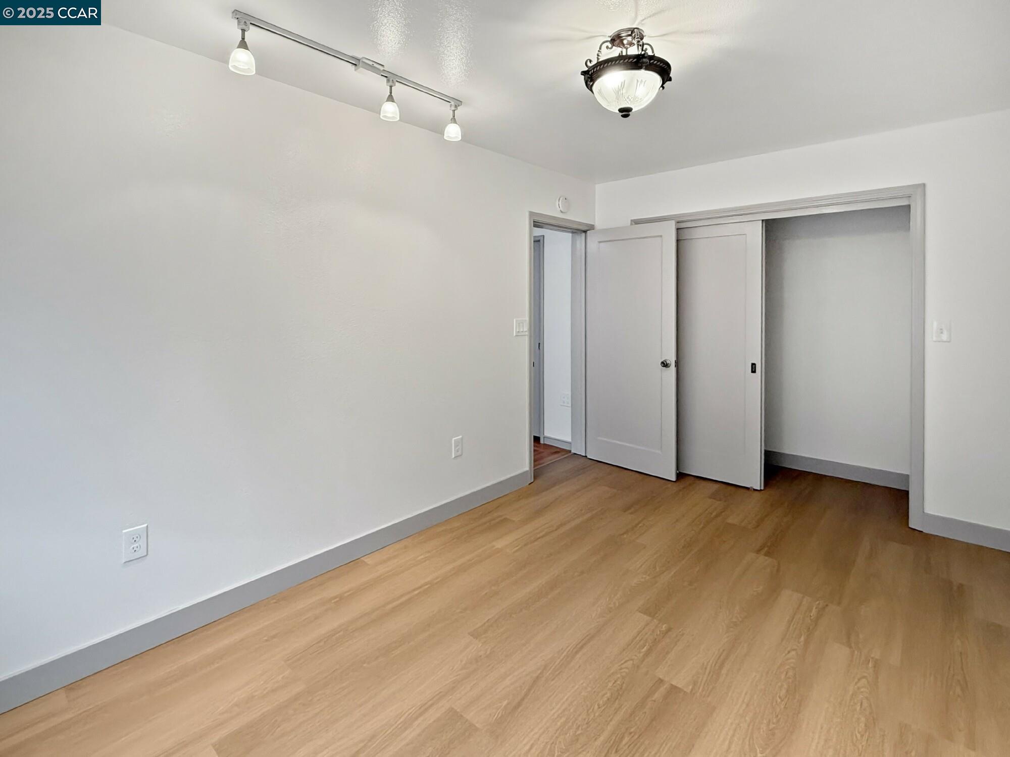 1919 Curtis Street Berkeley, CA 94702 - Photo 9 of 54 a view of an empty room with a window