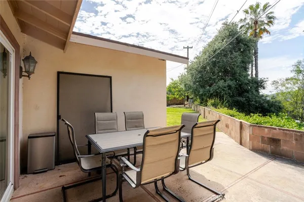 a patio with table and chairs