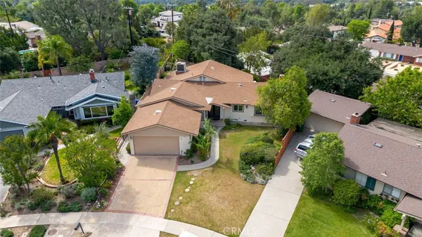 an aerial view of a house with a garden