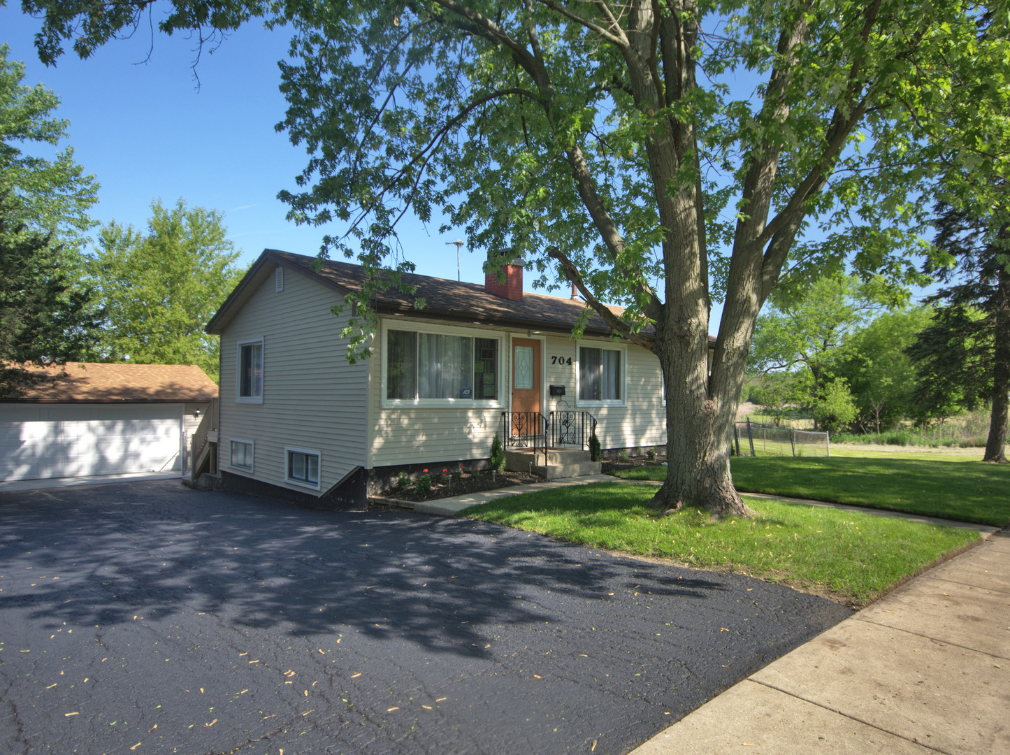704 South Oltendorf Road Streamwood, IL 60107 - Photo 1 of 1 a view of a house with a yard