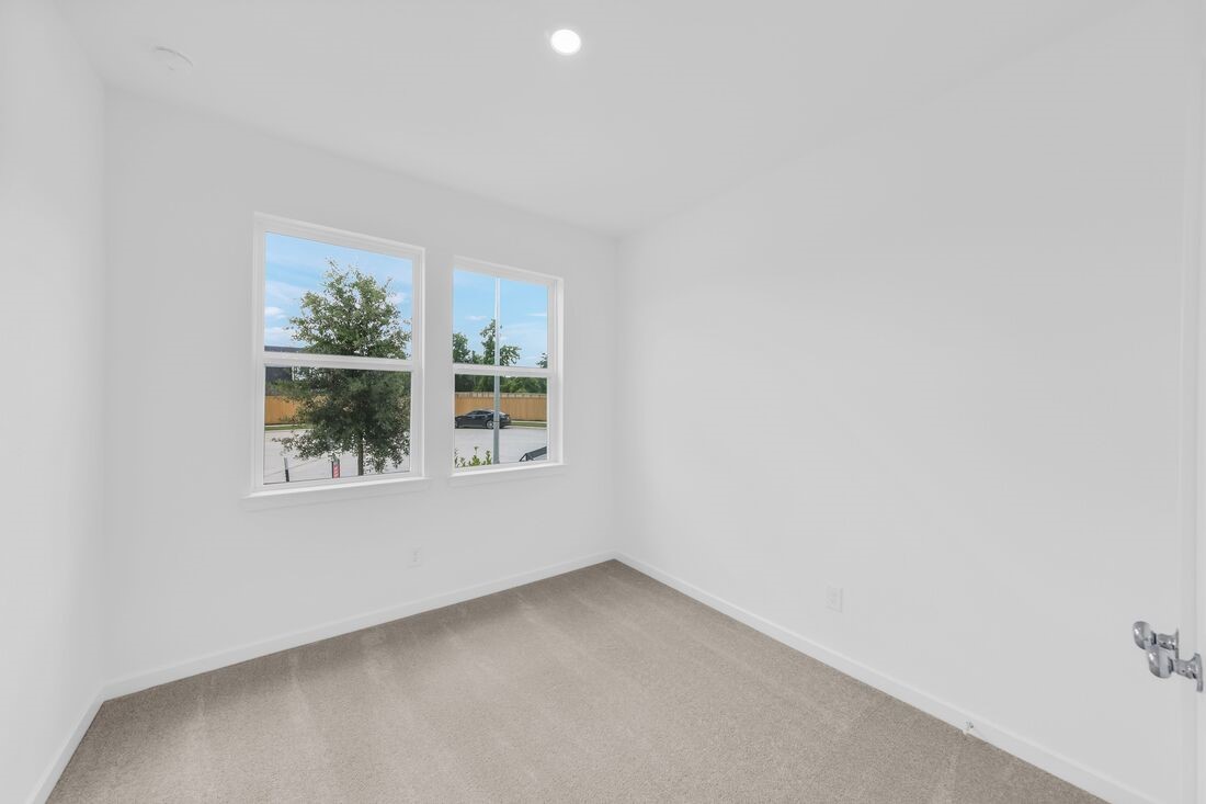 1107 Mattinson Rae Court Tomball, TX 77375 - Photo 12 of 32 an empty room with windows