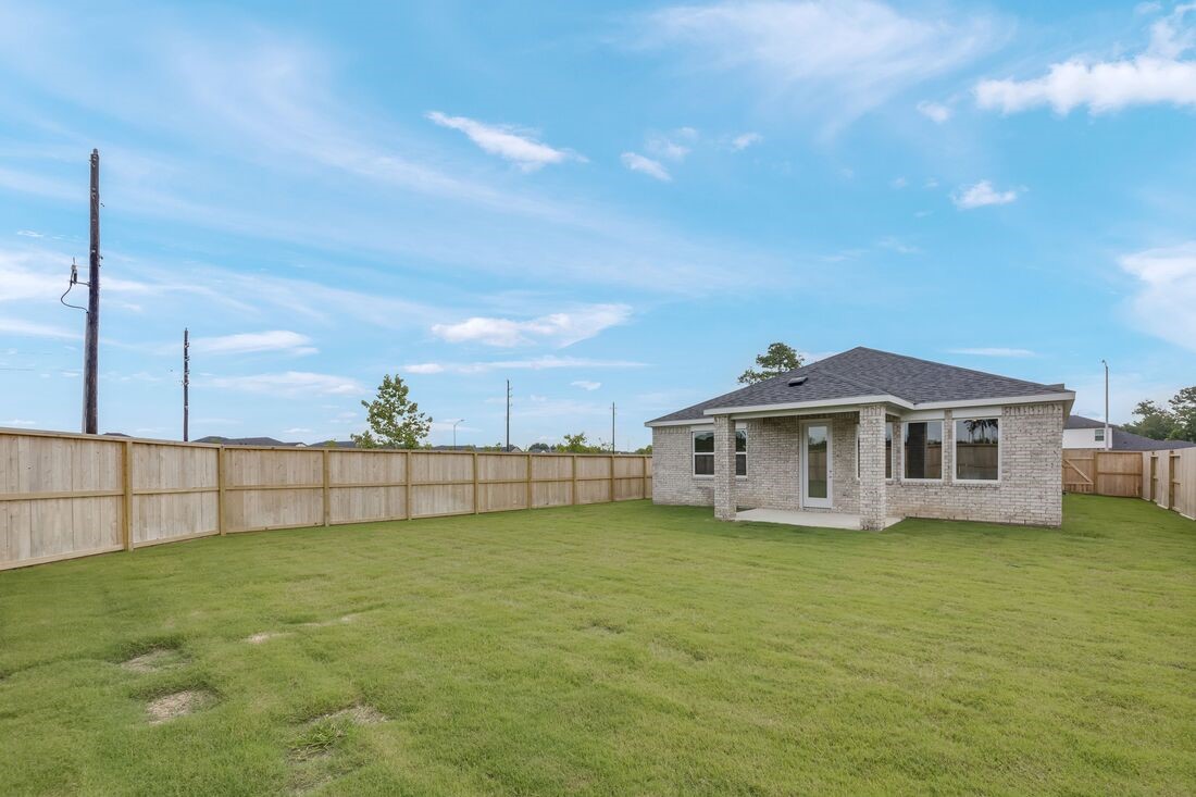 1107 Mattinson Rae Court Tomball, TX 77375 - Photo 15 of 32 a big white house with a big yard and large trees