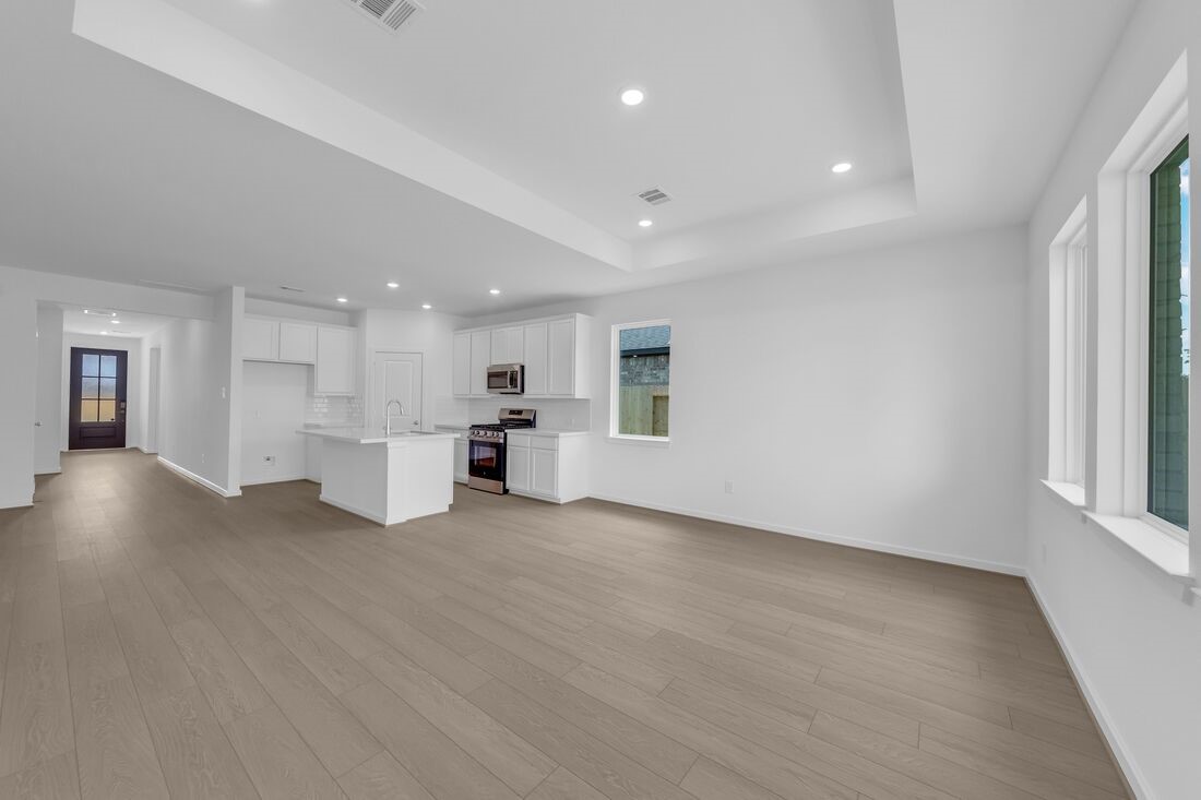 1107 Mattinson Rae Court Tomball, TX 77375 - Photo 5 of 32 a view of a kitchen with a sink and a large window